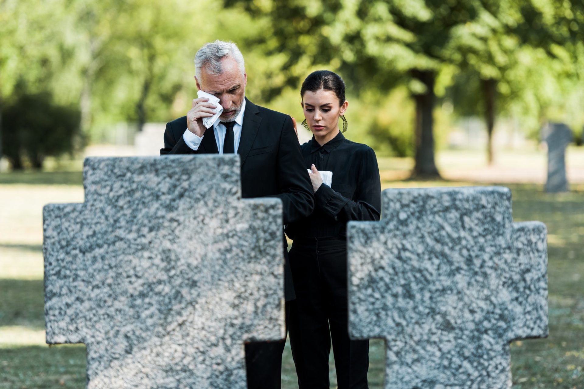 selective-focus-of-upset-man-crying-near-woman-on-funeral-e1636904714900.jpg